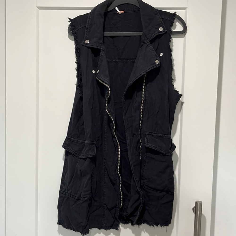 Distressed black moto vest.